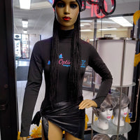 Black mannequin with wigs at Optimismic Wigs and Gifts 