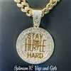 Hip hop gold pendants at Optimismic Wigs and Gifts.